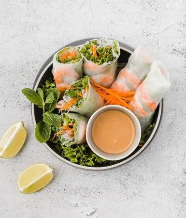 bowl-shrimp-rolls-with-sauce-lemon-slices (1) bowl-shrimp-rolls-with-sauce-lemon-slices (1)